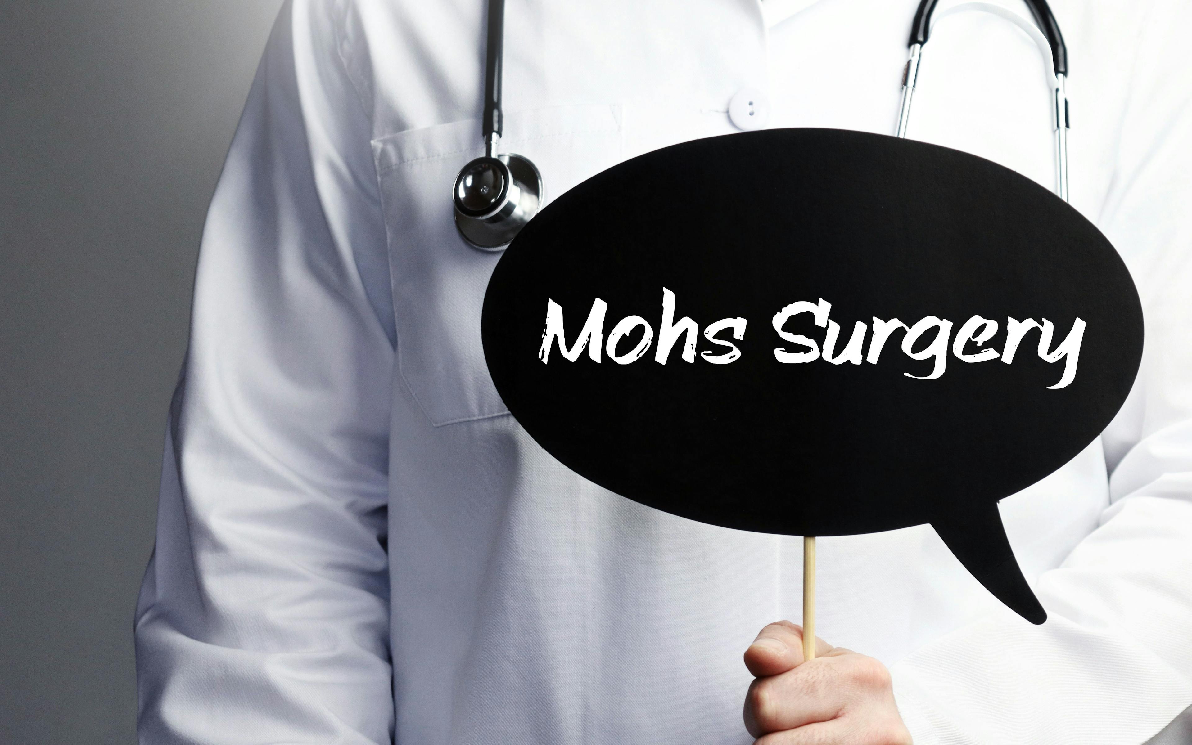 Mohs Surgery. Doctor with stethoscope holds speech bubble in hand. Text is on the sign. Healthcare, medicine | Image credit: © MQ-Illustrations - © stock.adobe.com
