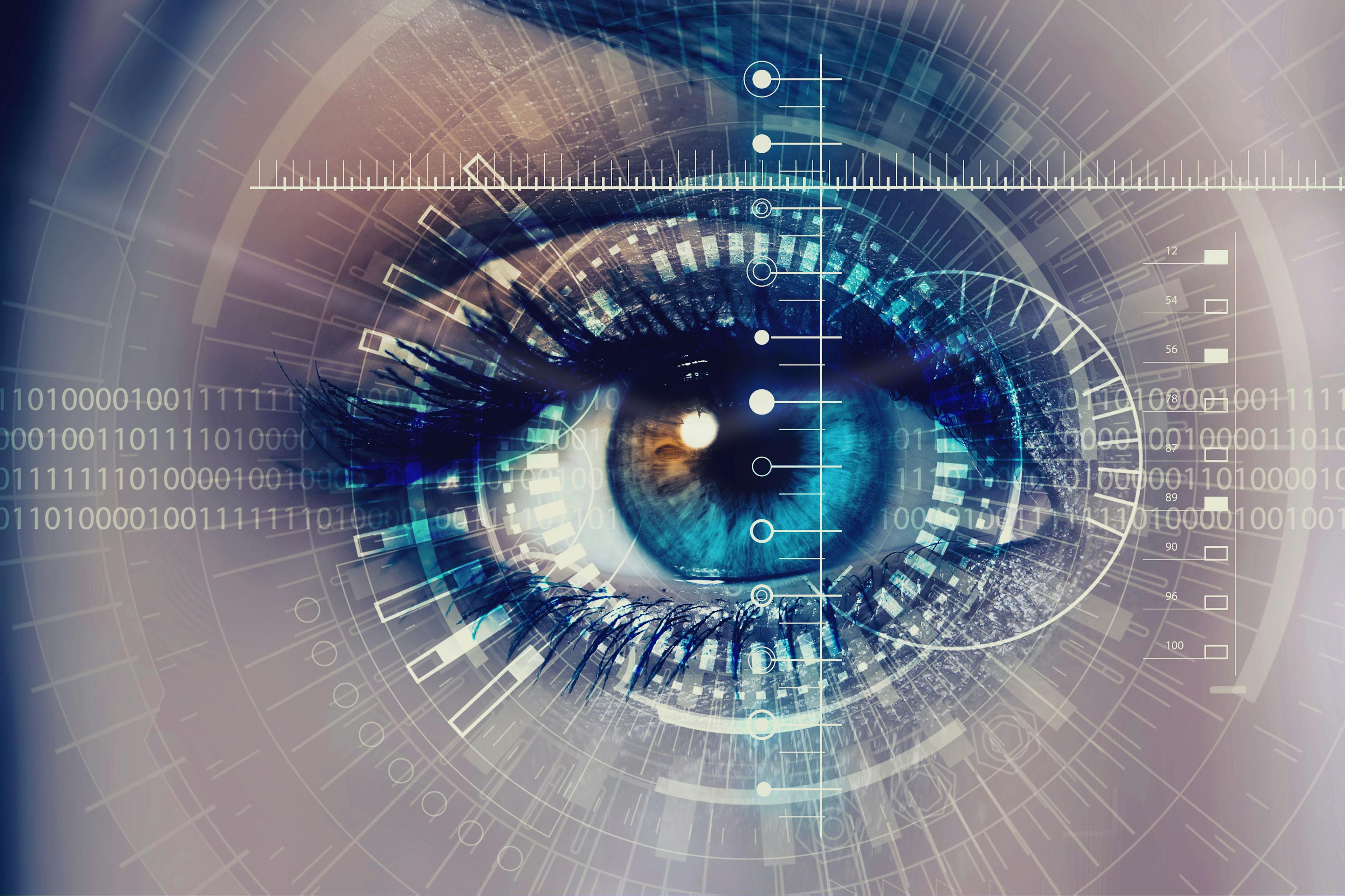 Image of a person's eye with graphics of technology on top.