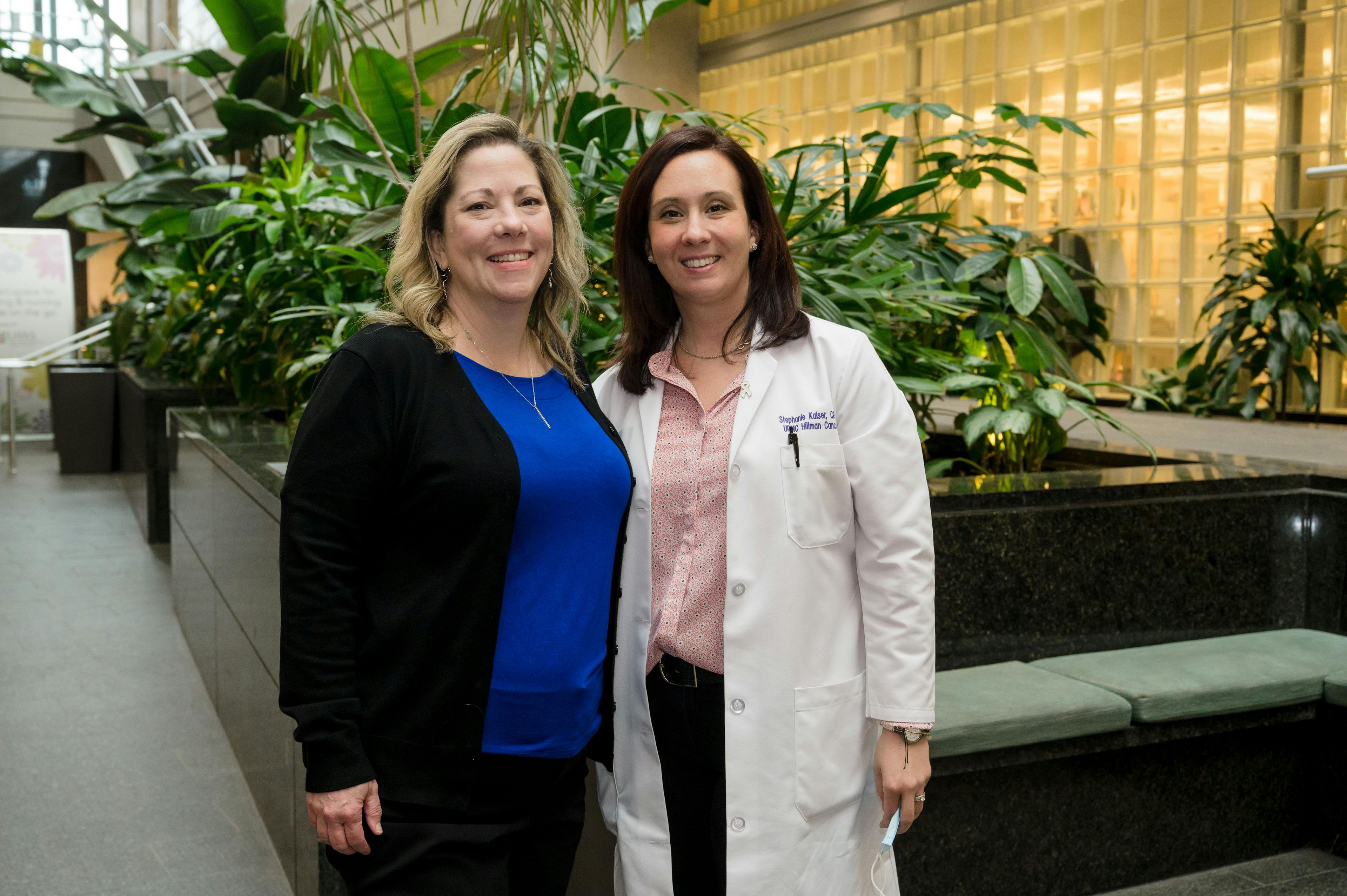 Stephanie Kaiser (right) stands with her nominator, Elizabeth de Jong, inside the lobby of the UPMC Hillman Cancer Center in Pittsburgh. 