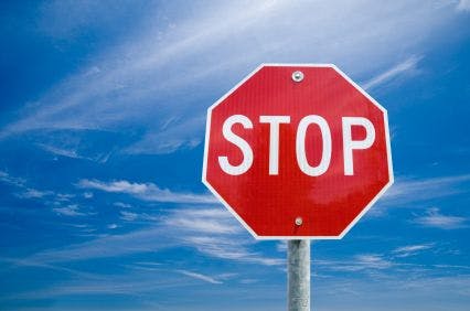 stop sign against blue sky background
