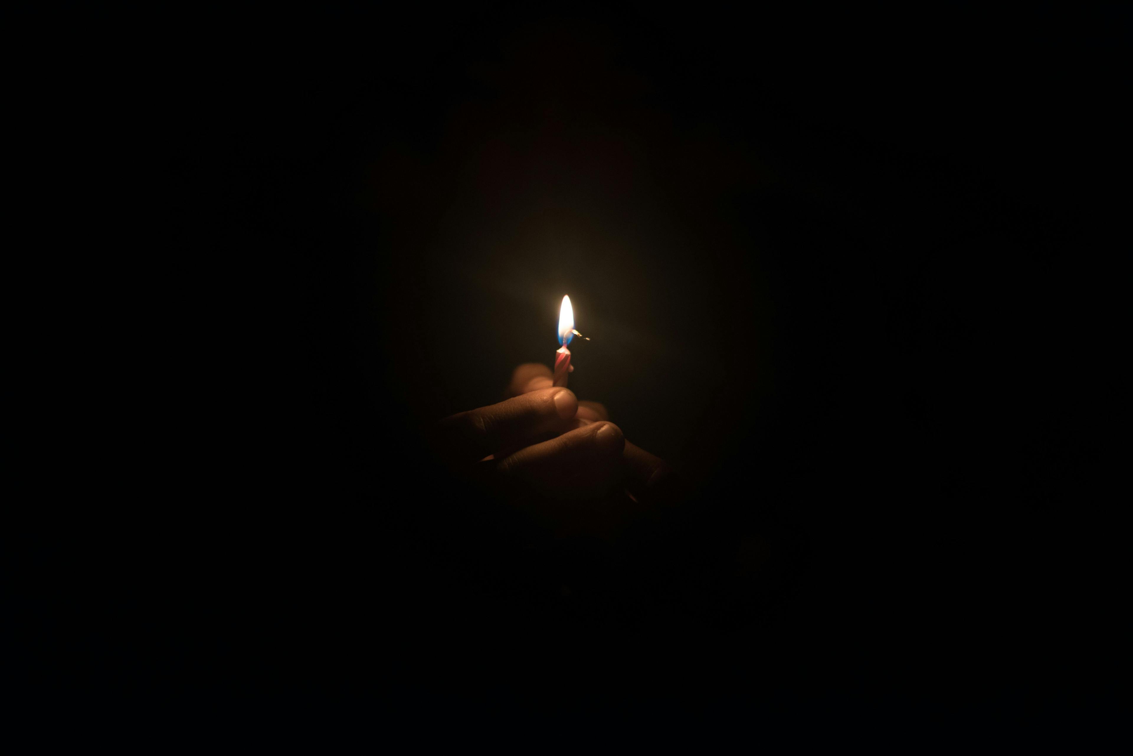 hand holding burning candle in the ark | Image credit: © - rushay © - stock.adobe.com