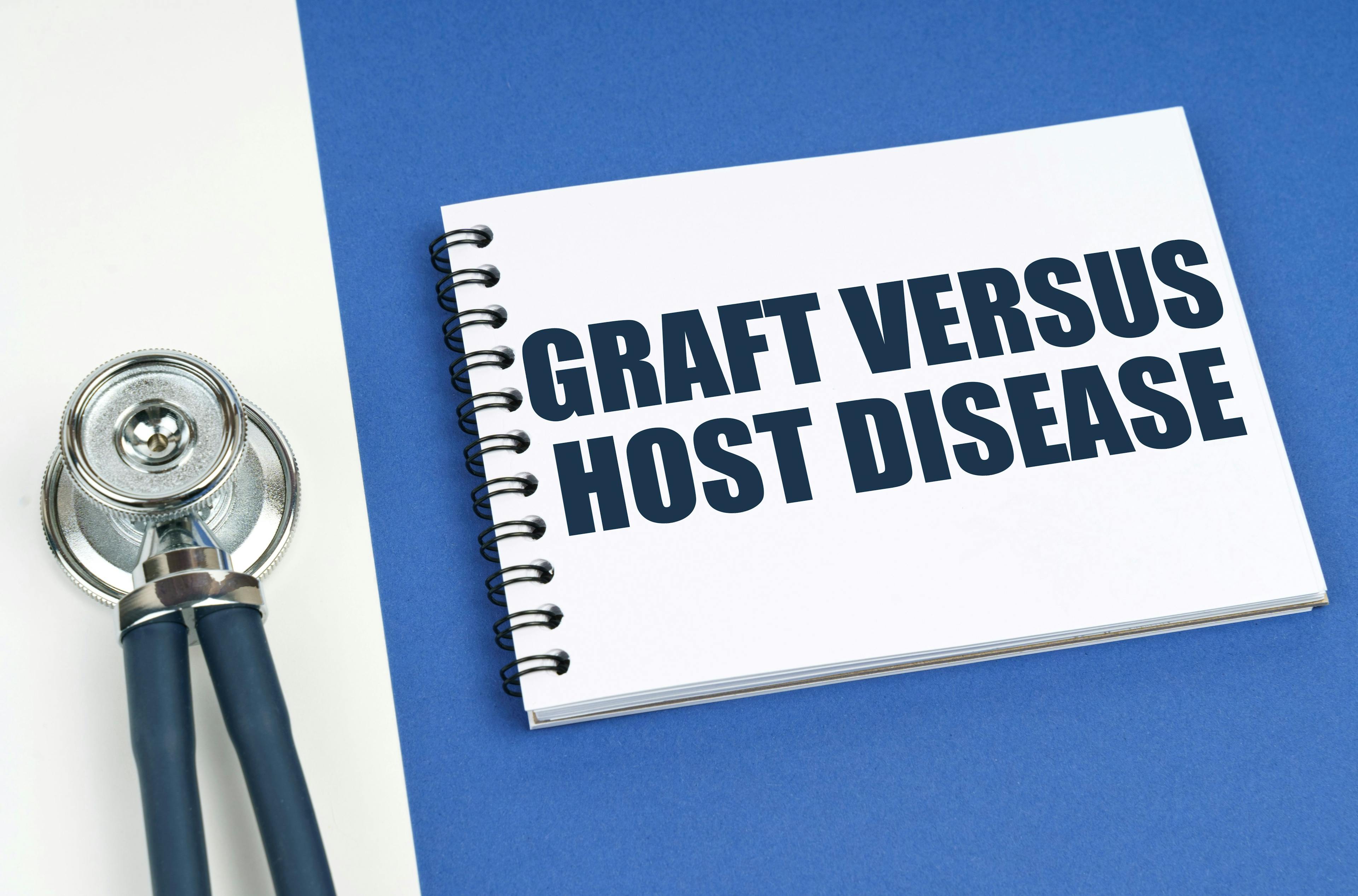 On a blue-white surface lies a stethoscope and a notepad with the inscription - Graft Versus Host Disease | Image credit: ©  Dzmitry - © stock.adobe.com