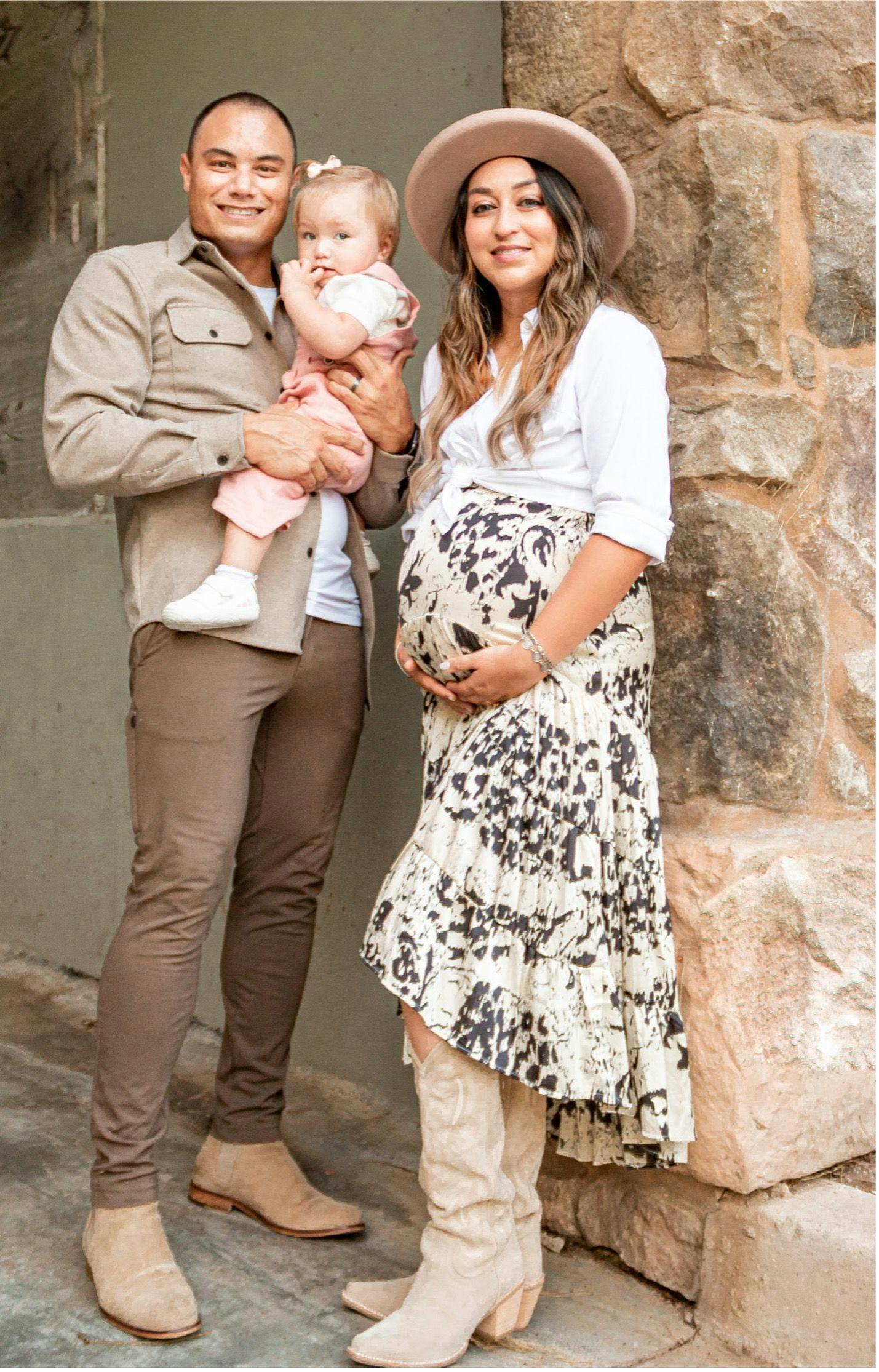 Pregnant Maresa King with her husband and daughter