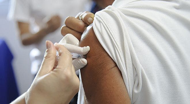 patient getting flu vaccine in arm