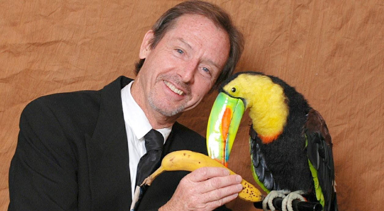 KHEVIN BARNES as DR. WILDERNESS interacting with his
animatronic toucan. - COURTESY KHEVIN BARNES
