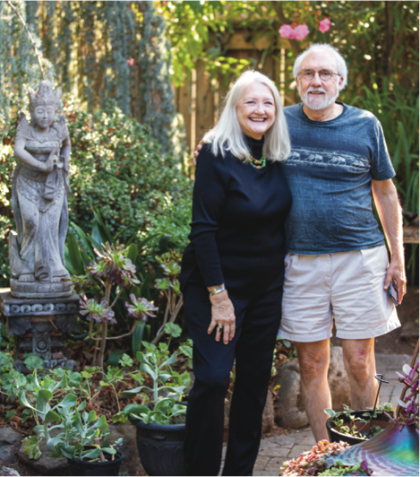 Renata and Ralph Muller standing in front of a garden