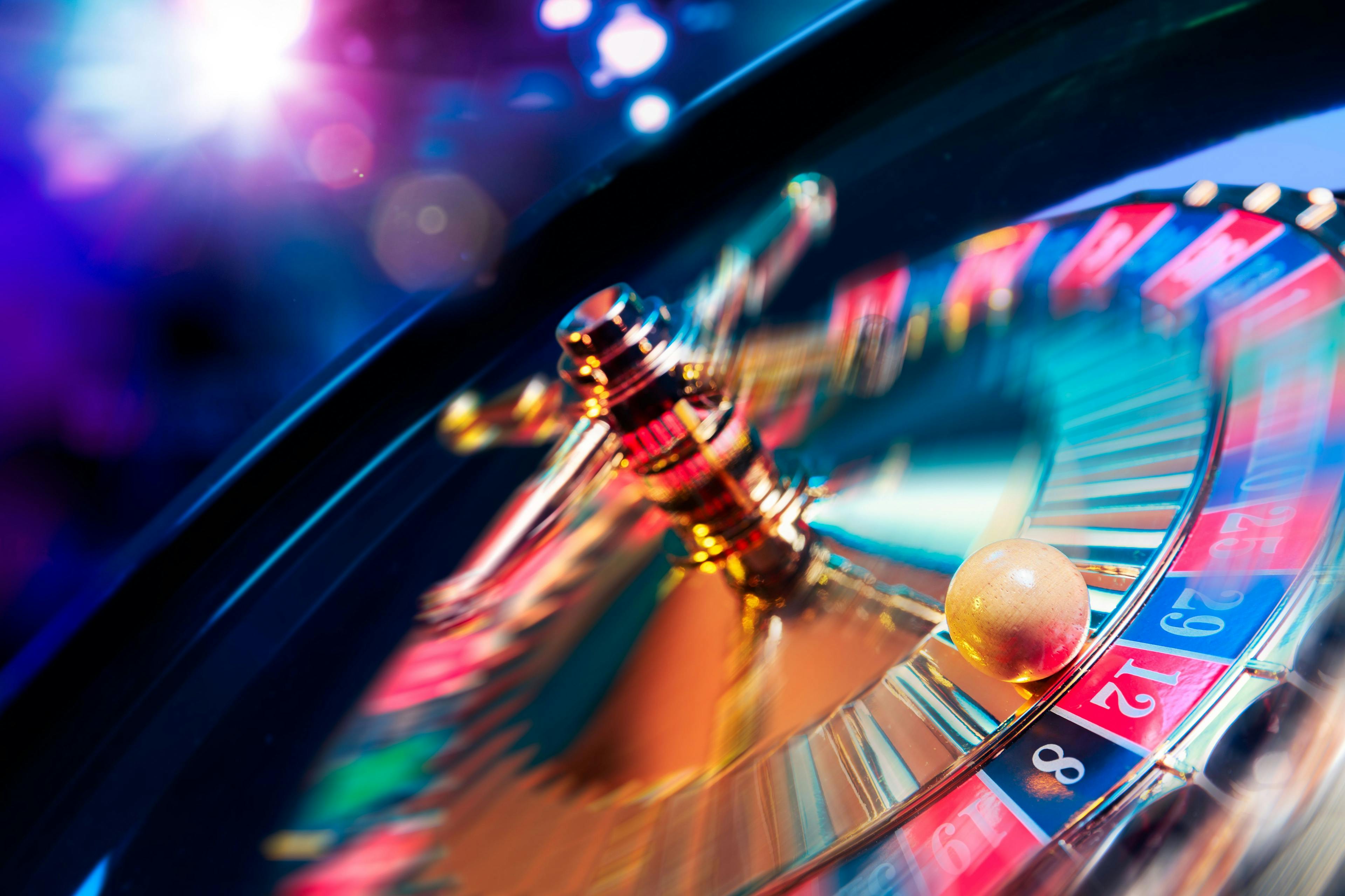 Roulette wheel in motion with a bright and colorful background | Image credit: fergregory -  © stock.adobe.com