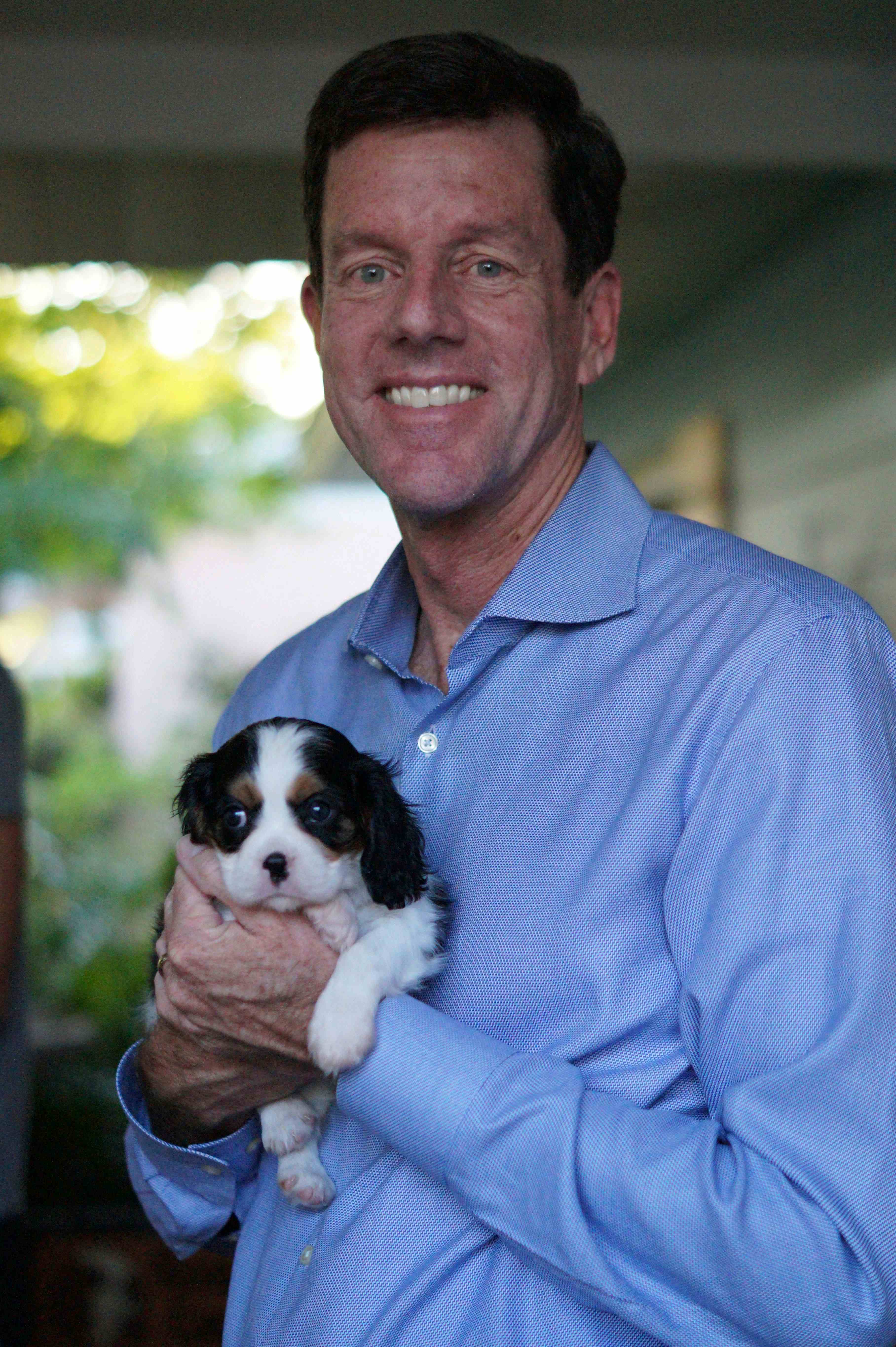 Bill C. Potts holding his small dog, Pippa | Photo credit: Sarah Potts 