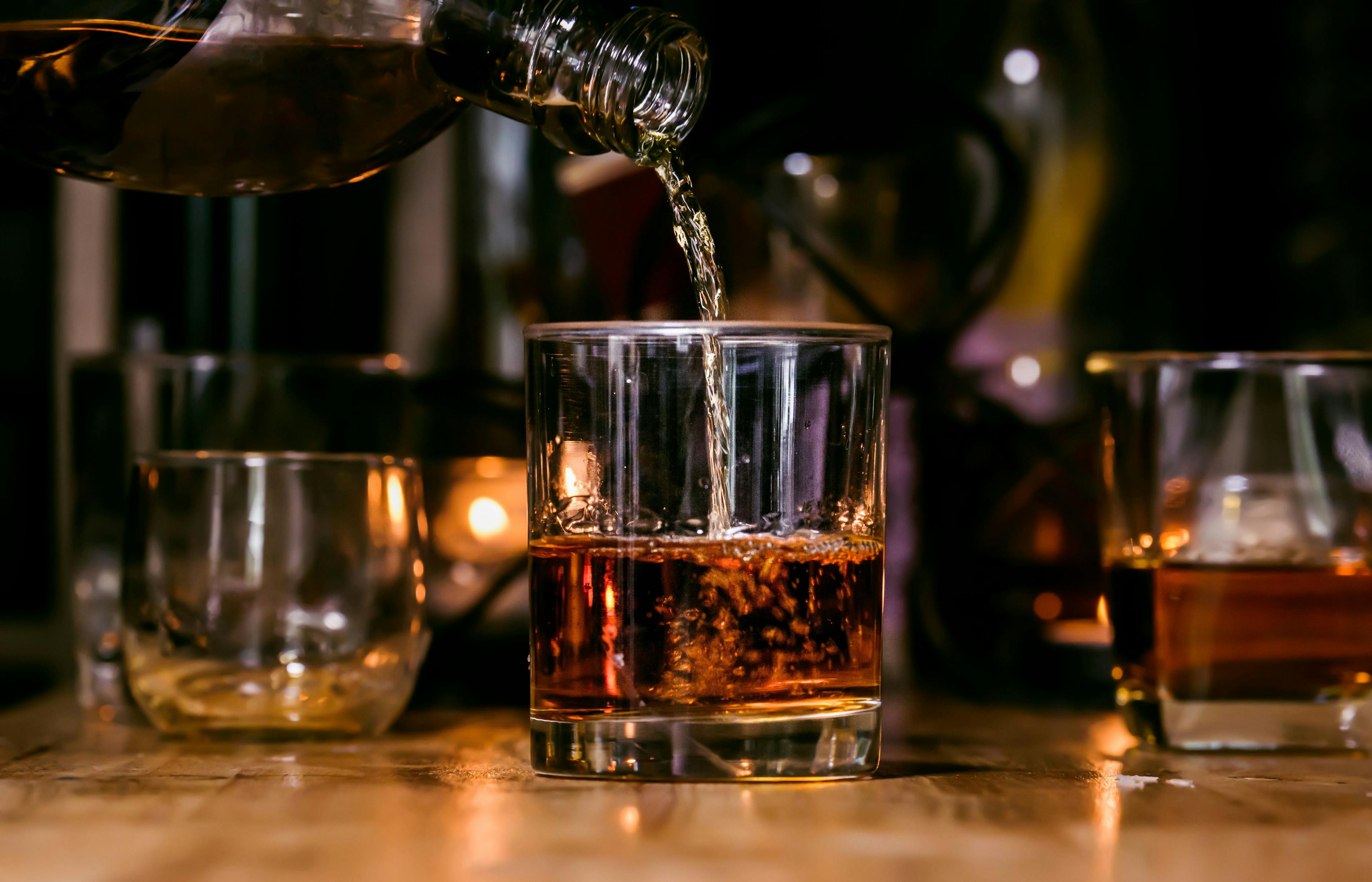 Bartender Serve Whiskey, on wood bar | Image credit: © maeching - © stock.adobe.com