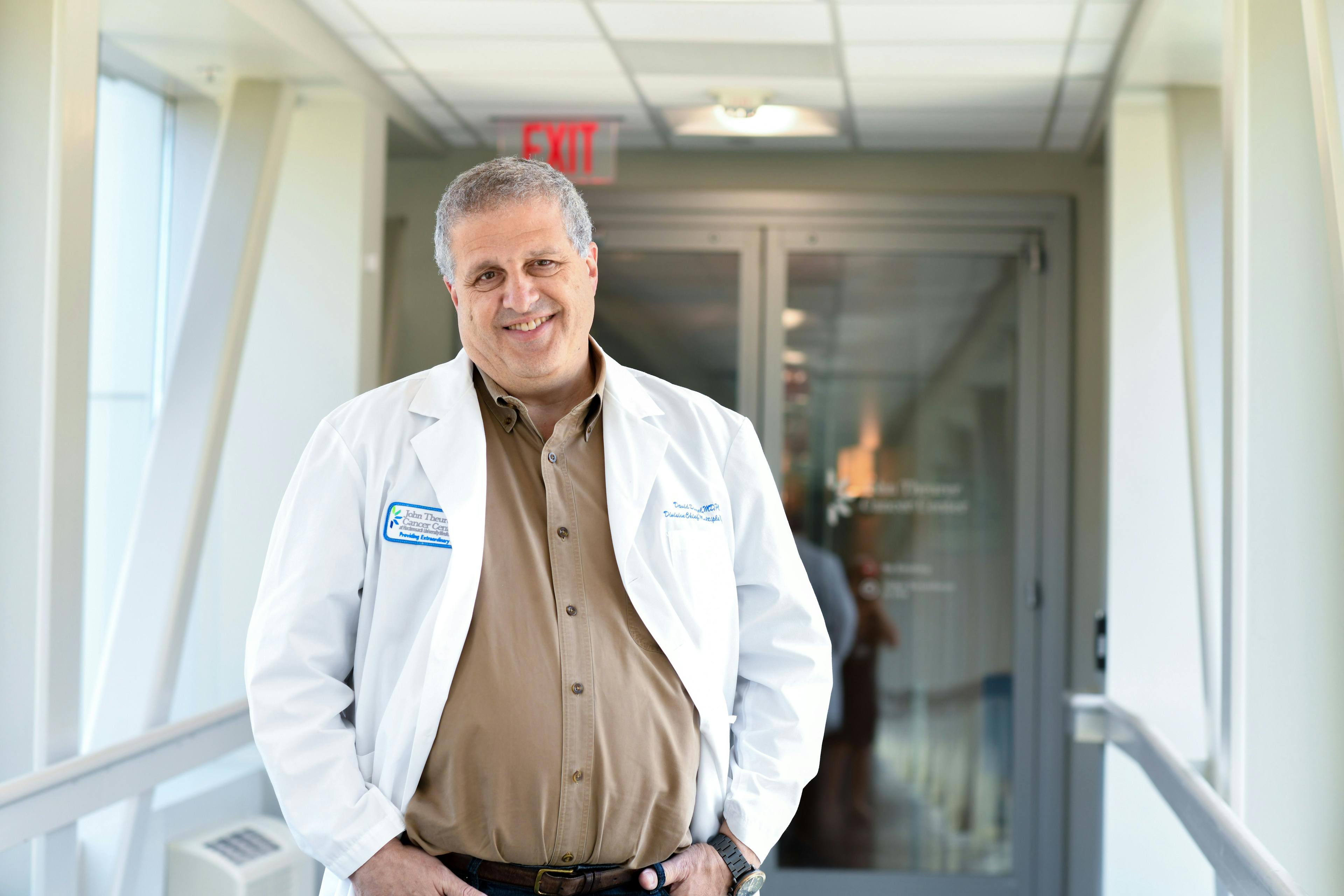 Dr. David Siegel in a white coat