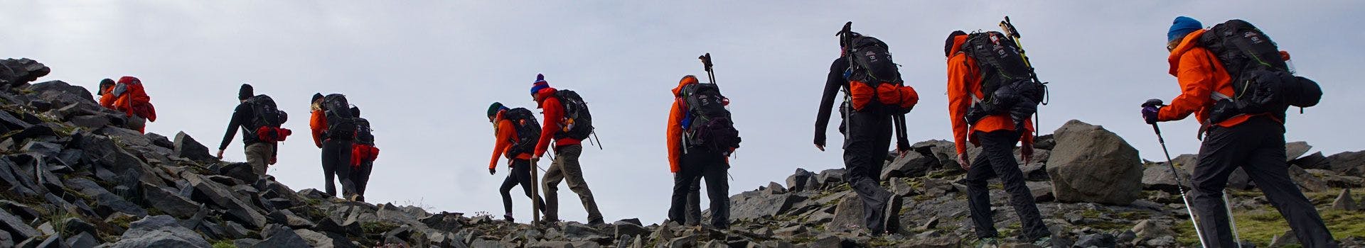 Hikers climbing up a mountain