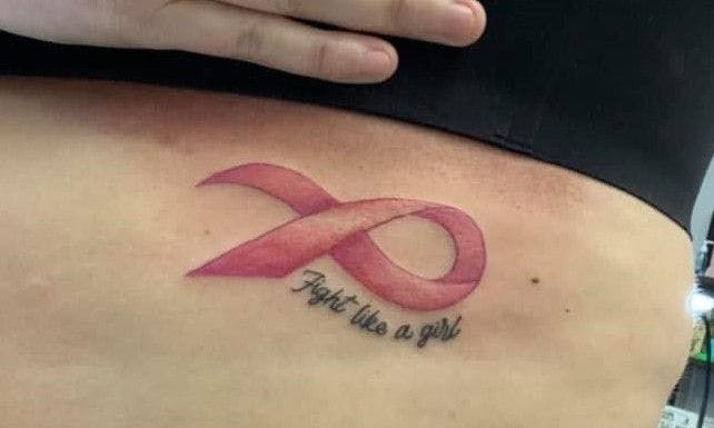 Legault's daughter Adrienne opted for a pink ribbon tattoo. 