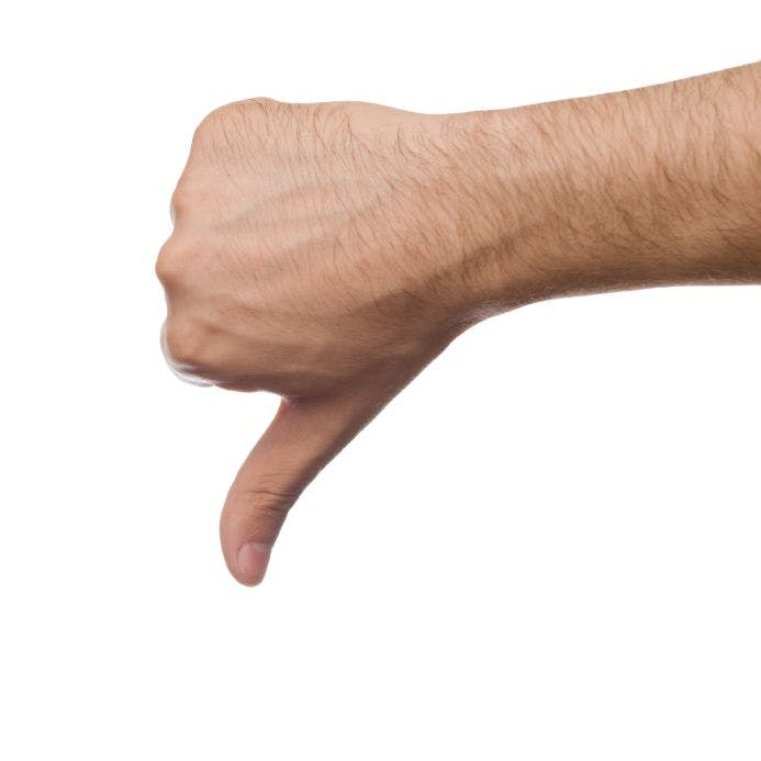 a man's hand signaling thumbs down 