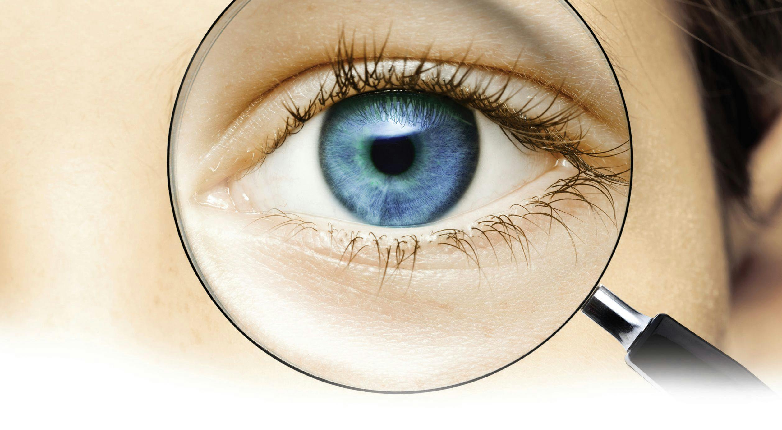 magnifying glass looking at an eye