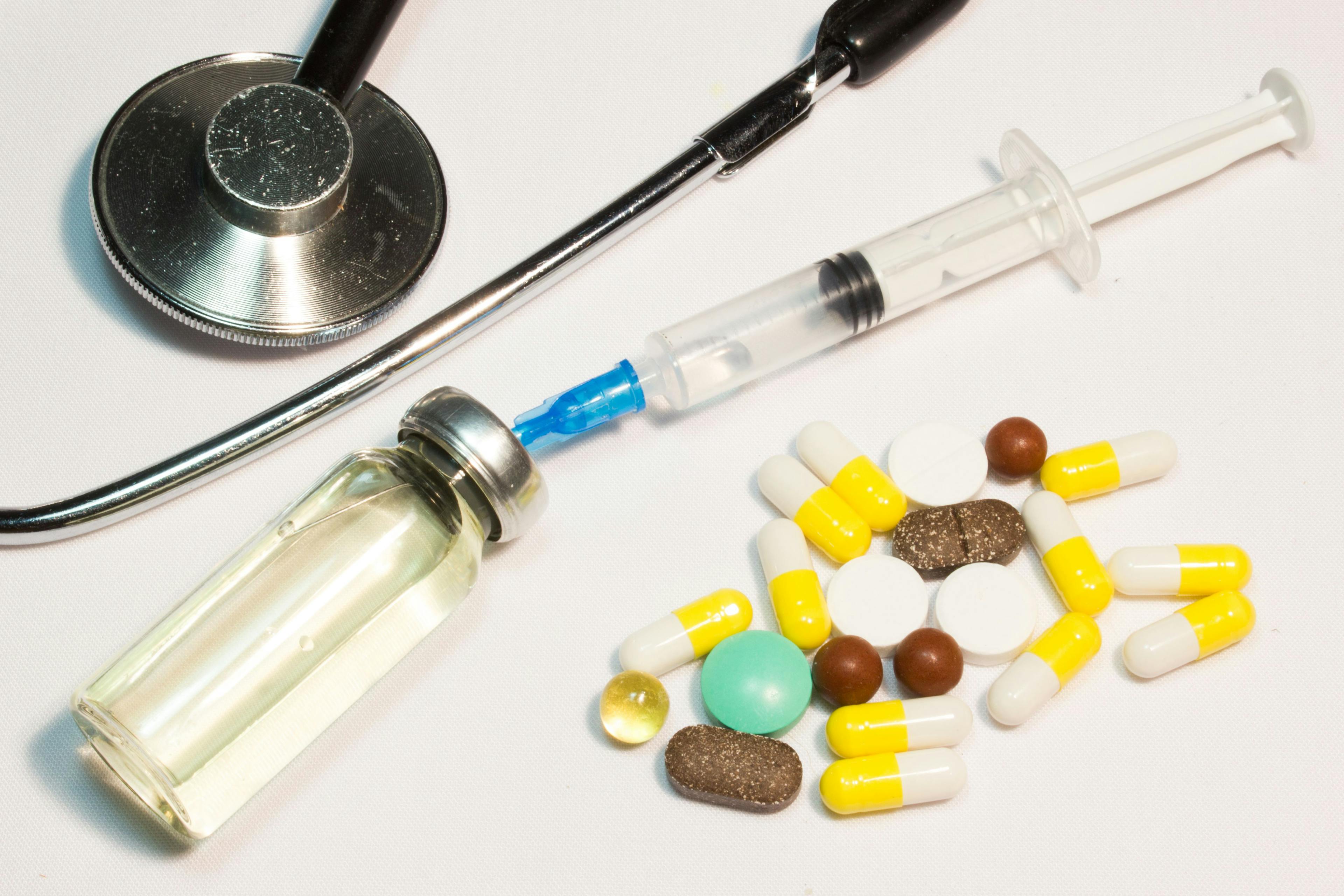 stethoscope, vial, and pills
