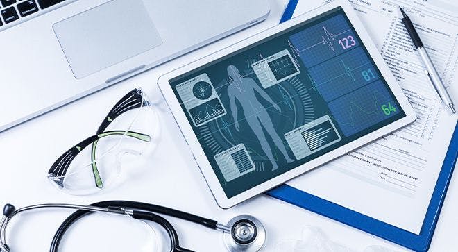 iPad with medical information on it next to a stethoscope 
