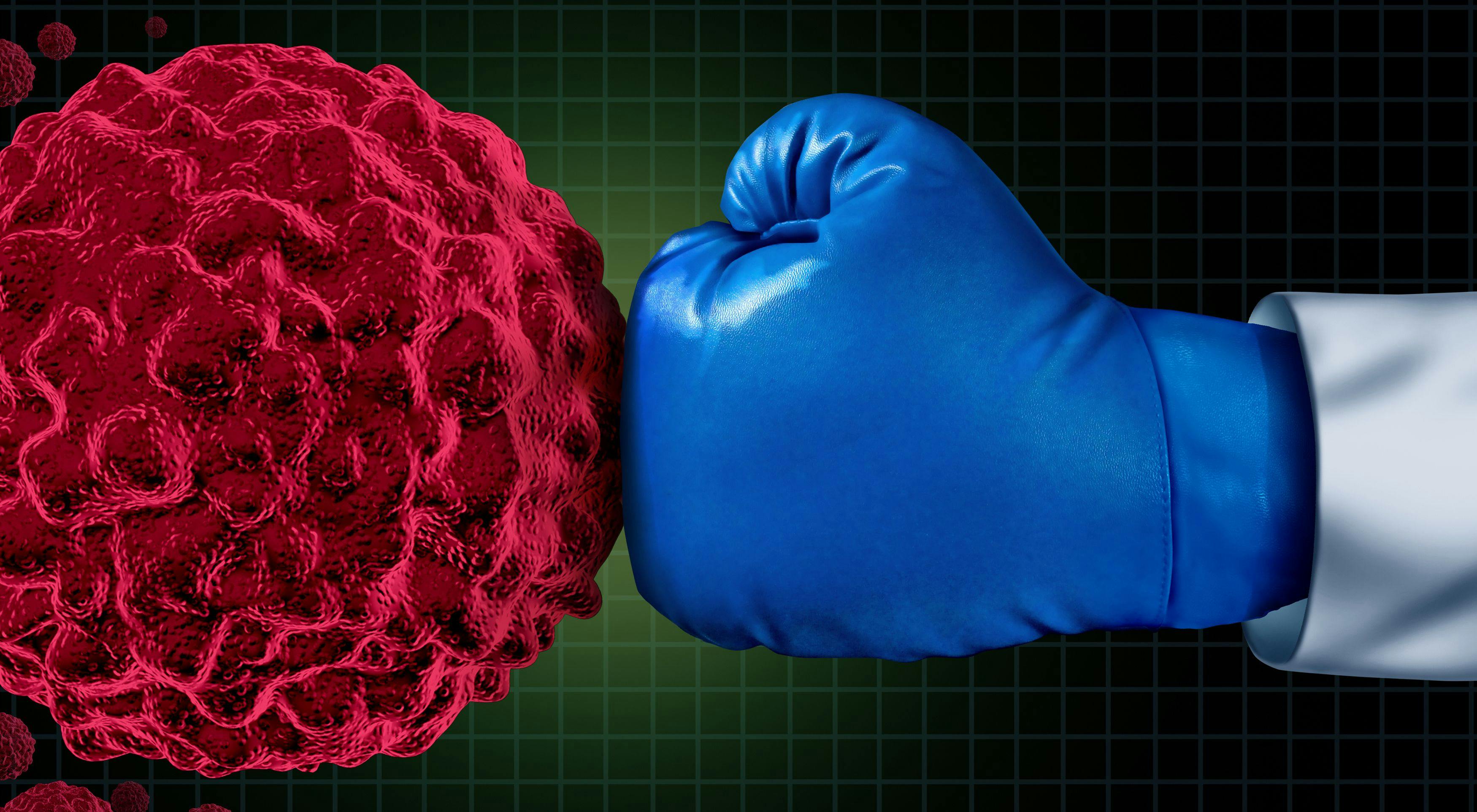 hand with blue boxing glove punching a cancer cell