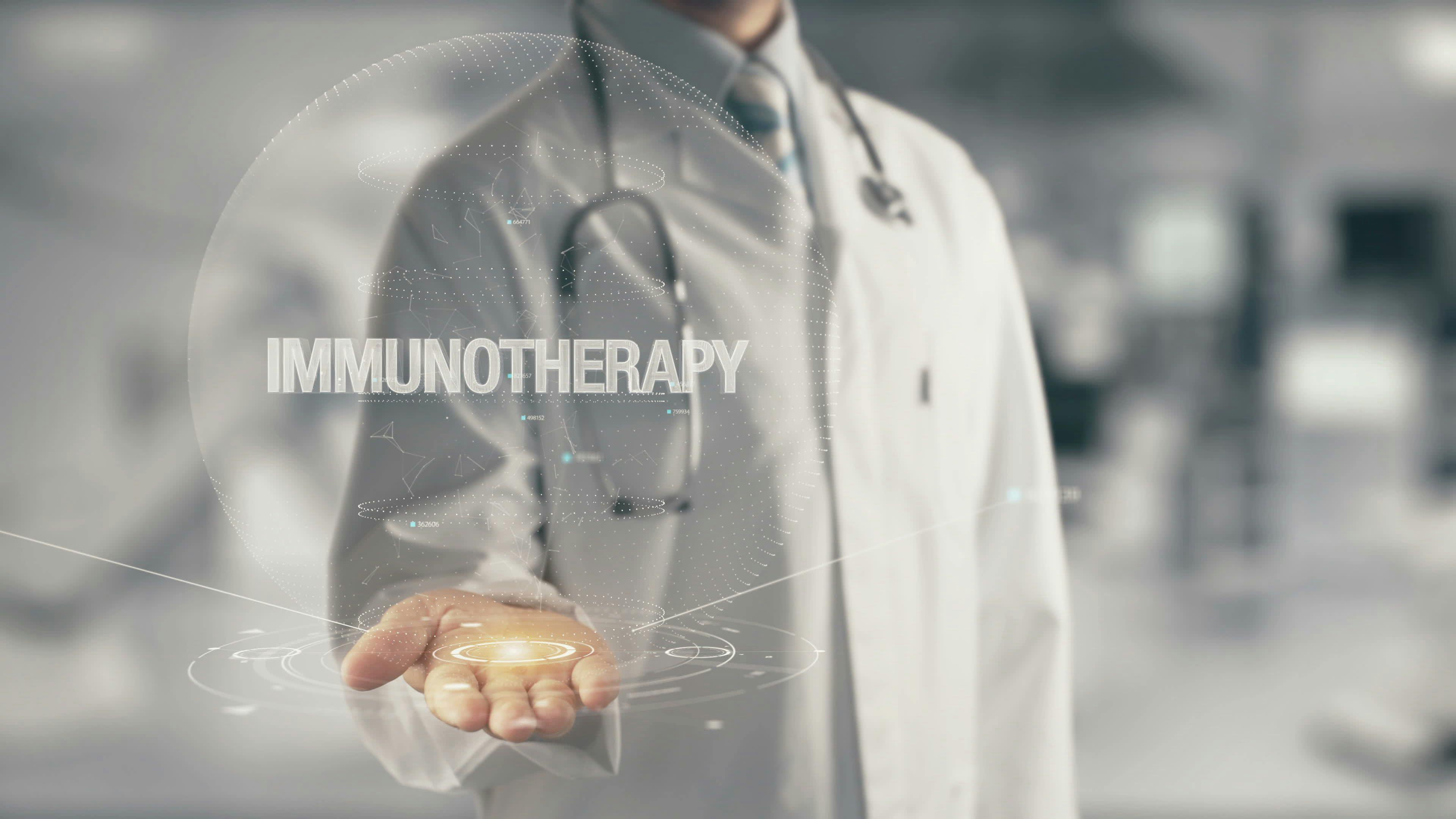 doctor in a while coat holding his hand under the word "Immunotherapy"