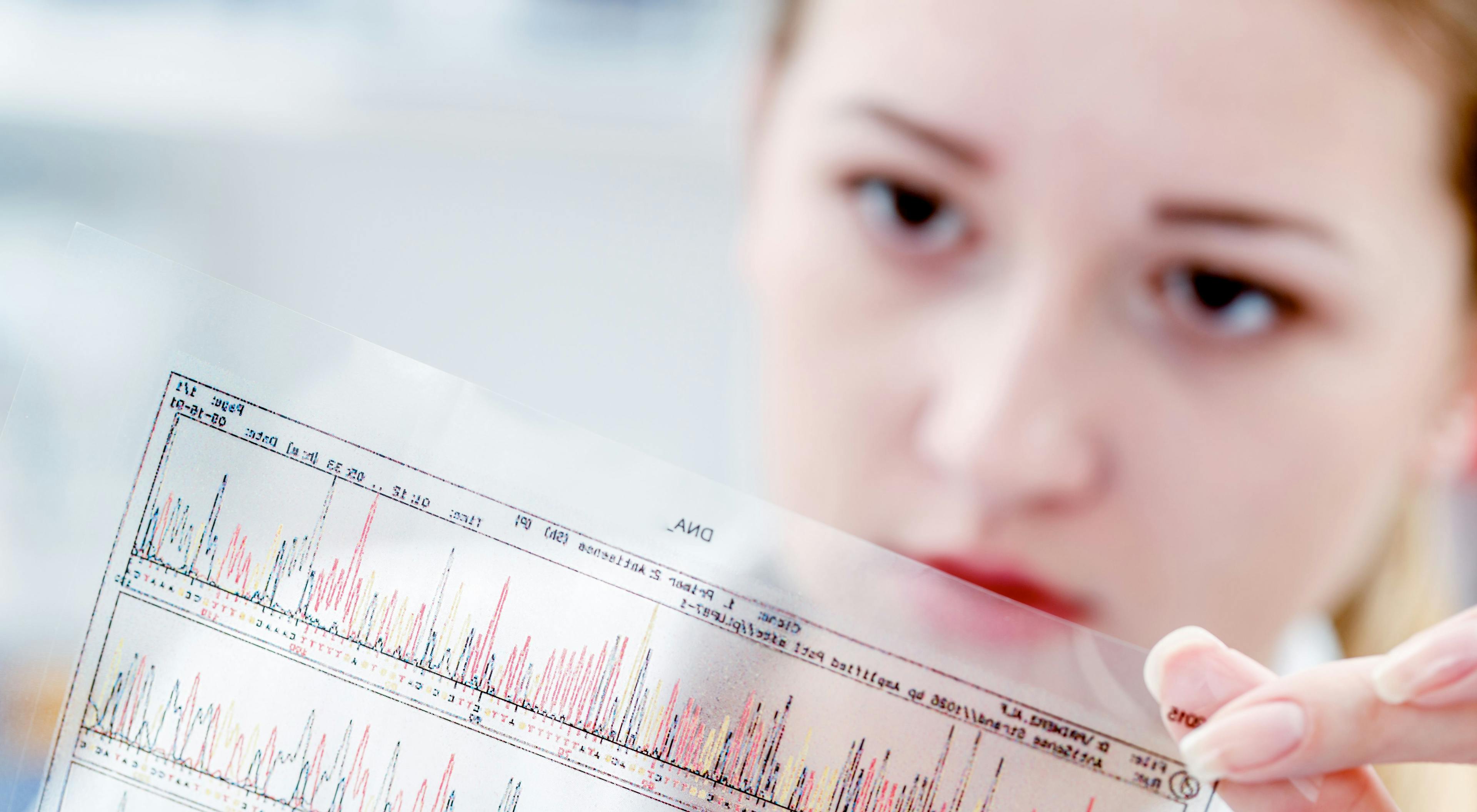 woman examining DNA sequence