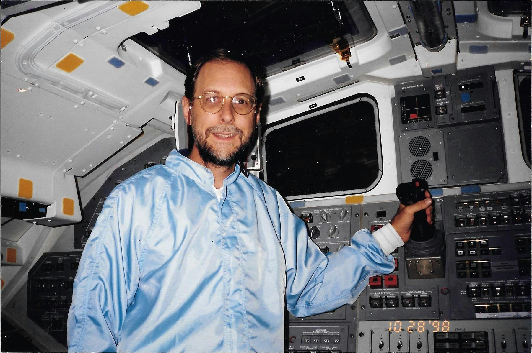 On the flight deck of the Orbiter Atlantis, in a rare shot without an 