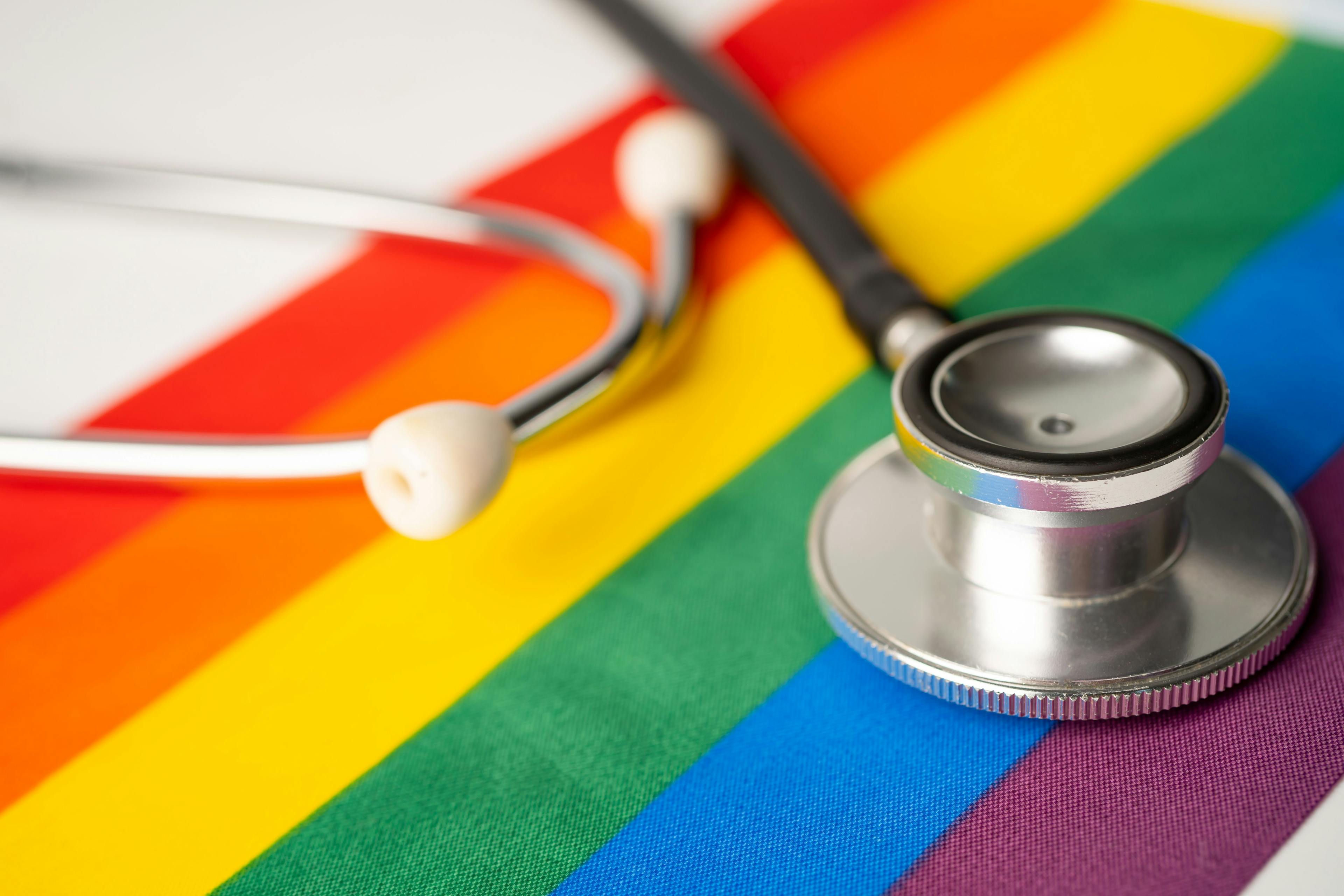 Black stethoscope on rainbow background, symbol of LGBT pride month celebrate annual in June social, symbol of gay, lesbian, gay, bisexual, transgender, human rights and peace. | Image credit: amazing studio - stock.adobe.com