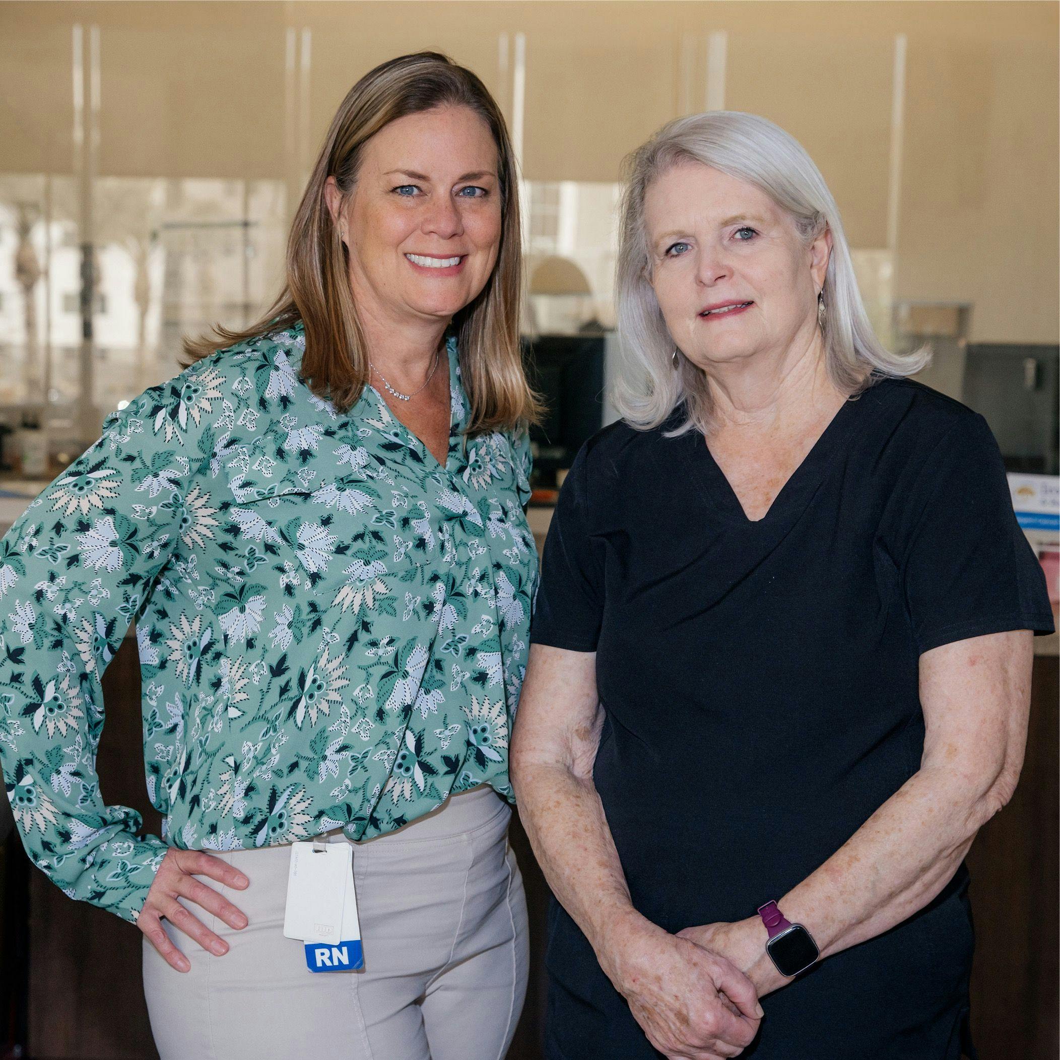 From left: Lori Shattuck, RN, OCN and Kathy Shine,  B.S.N., RN, two oncology nurses smiling at the camera |    Photo by: Azula Raun 
