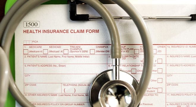 Health insurance claim form with a stethoscope on top
