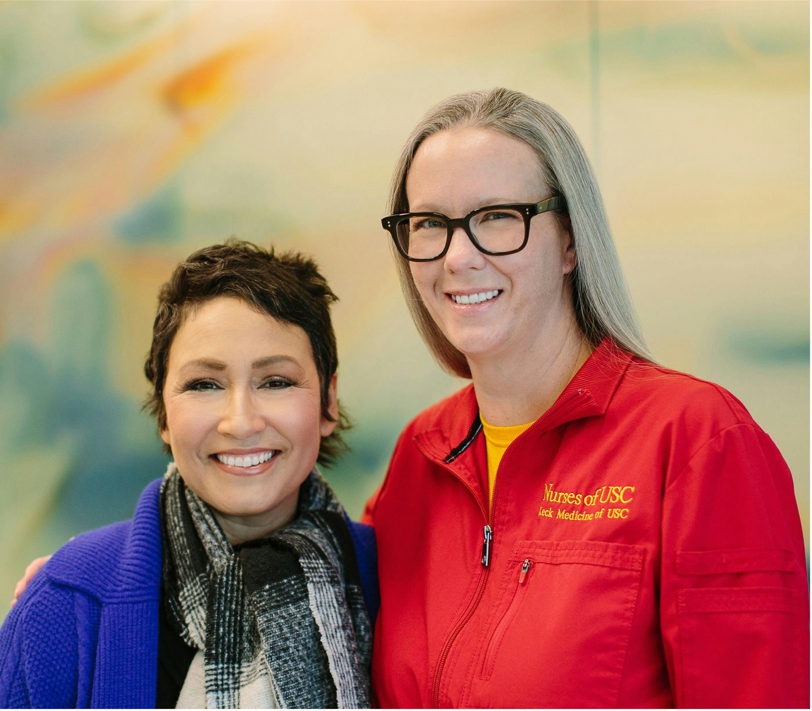 A cancer survivor and her oncology nurse smiling at the camera: From left: Teresa Carrillo and Carrie Williams, M.S.N./Ed, RN
